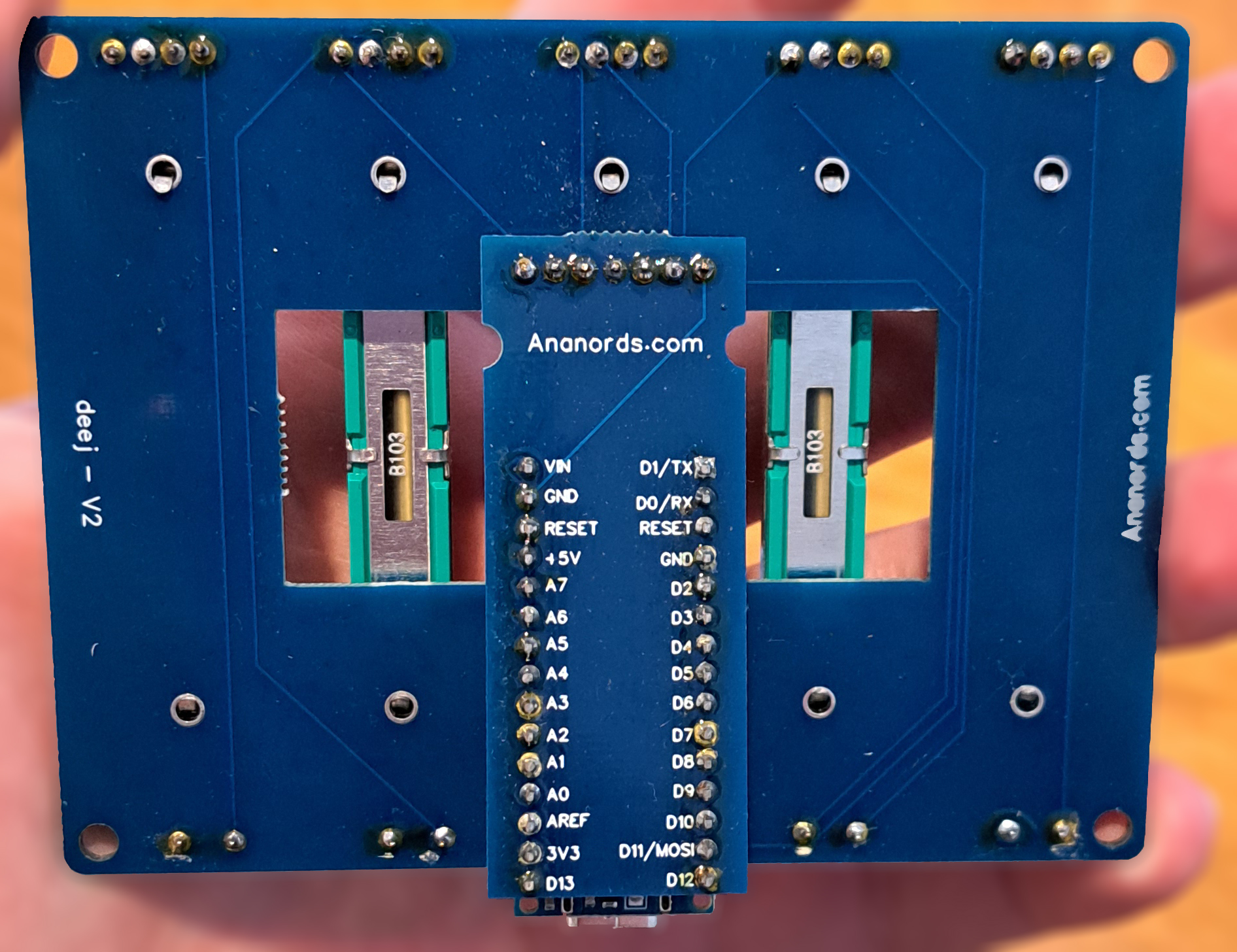Underside of the Deej audio mixer PCB showing solder joints and Arduino-compatible controller connections