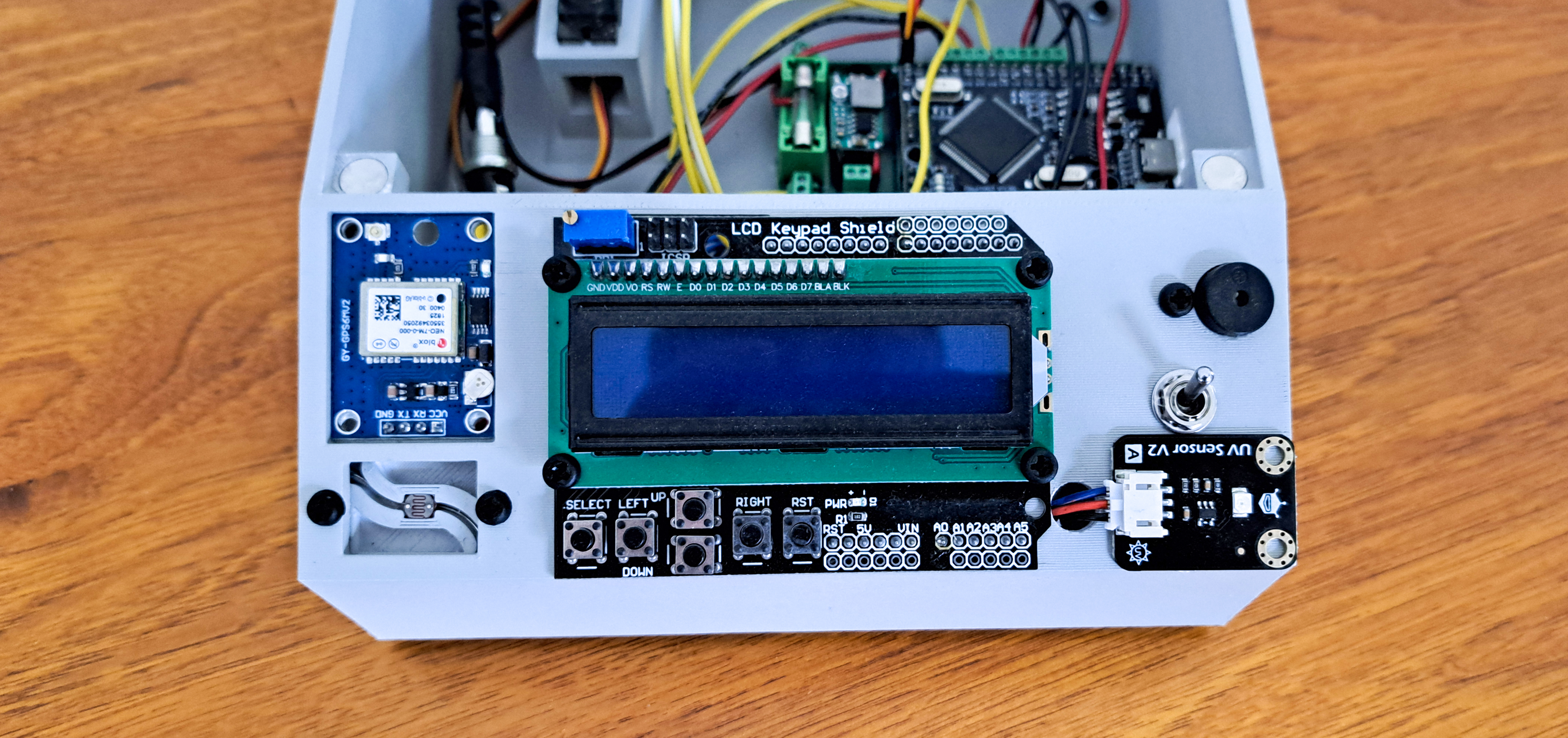 Sensor panel overview showing the LCD, GPS module, UV sensor, LDR and user controls mounted on the weather station front panel